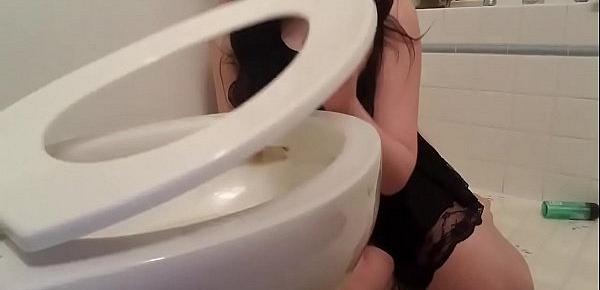  Goth girl licks toilet with a tampon